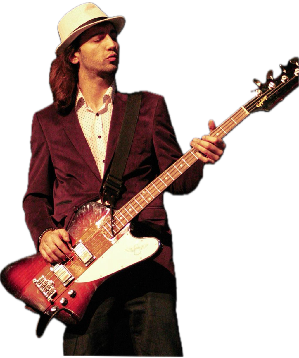 Ataberk playing bass on stage